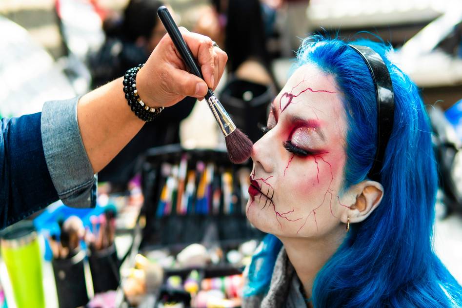 A vibrant display of character makeup featuring bold colors and intricate designs for costume inspiration