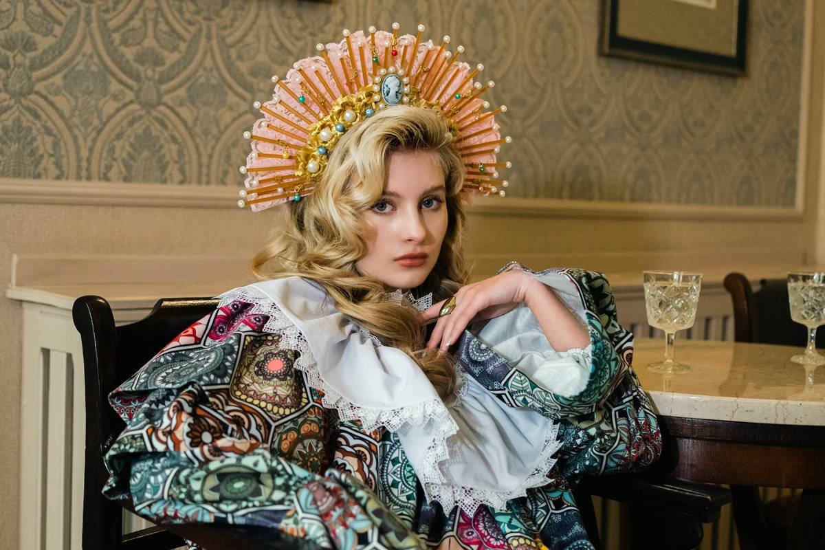 actor applying historical performance makeup using period-accurate pigments and tools