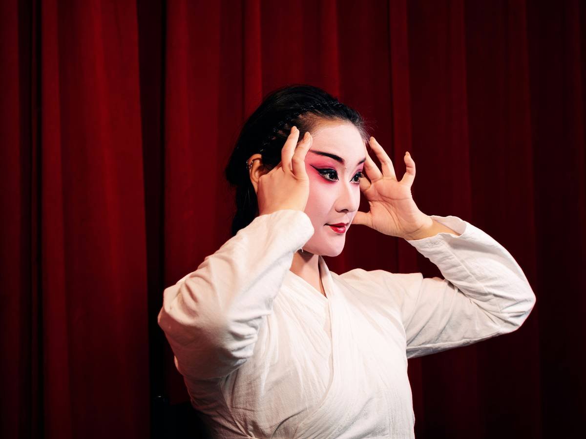 Character makeup designs showing intricate facial prosthetics and layered paint on a performer's face